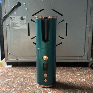 automatic curling iron **timer and spins automatically!!**